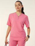 Woman wearing a pink Scrubs from Workin Gear