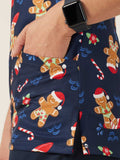 Woman wearing a navy blue christmas Scrub Top