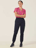 Workin Gear Woman wearing a pink Christmas scrub top  