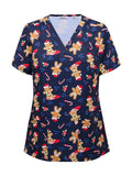 Woman wearing a navy blue christmas Scrub Top