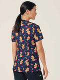 Woman wearing a navy blue christmas Scrub Top